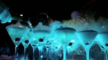 Champagne from cherry and steam with dry ice, champagne with smoke