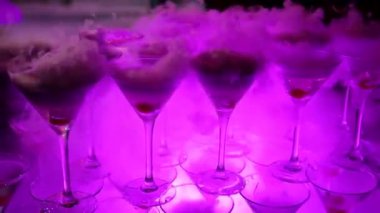 Champagne from cherry and steam with dry ice, champagne with smoke