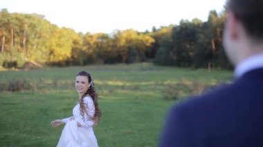 Beautiful Sunset Wedding. Bride and Groom at Sunset