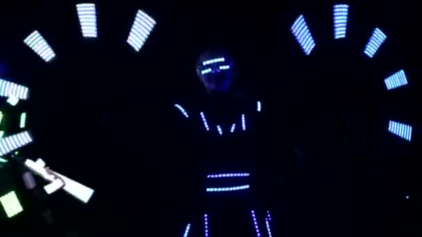 Laser show performance, dancers in led suits with LED lamp, very beautiful night club party. — Stockvideo