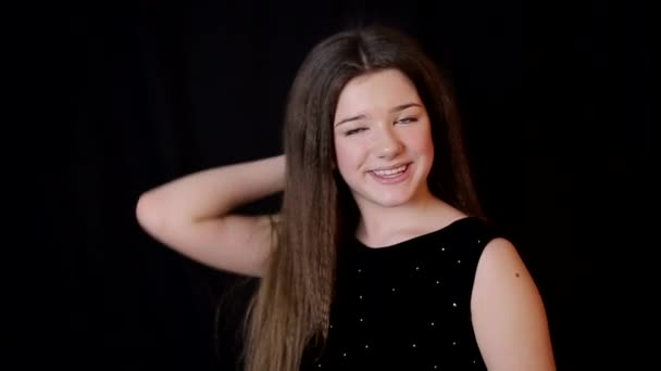Beautiful pilete woman portrait on black background, happy girl — Stockvideo