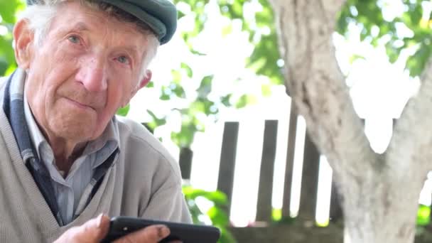 Grandpa Cries Looking His Smartphone Remembers Young Years His Life — Stock Video