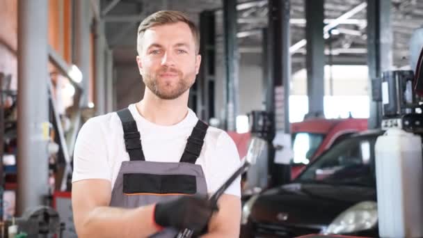 Portrait European Car Mechanic Looks Camera Laughs Happily Car Service — Stock Video