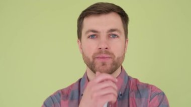 A man with eye health, redness. Face of man with annoyed red eyes, portrait of handsome man isolated on background in studio.