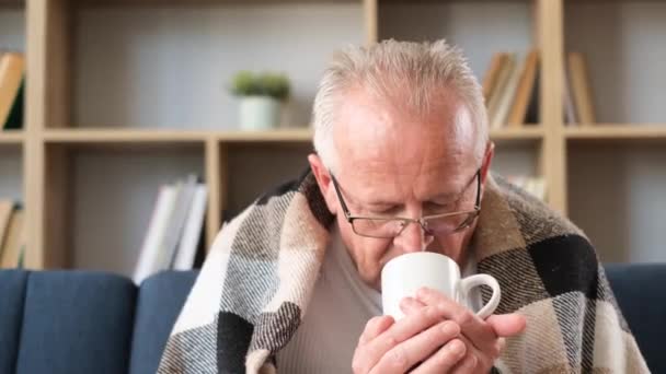 Old Sick Grandfather Drinks Tea Wrapped Blanket Looking Away Video — Vídeos de Stock