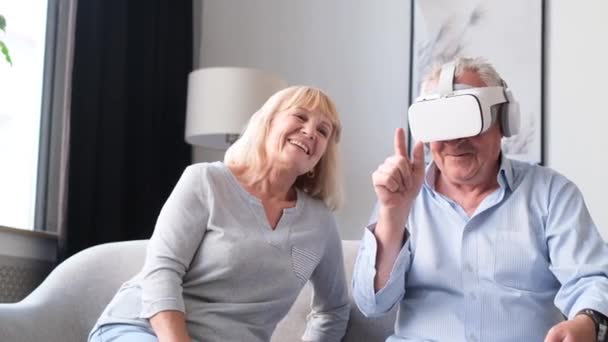 Portrait Elderly Couple Using Virtual Reality Glasses While Sitting Living — ストック動画