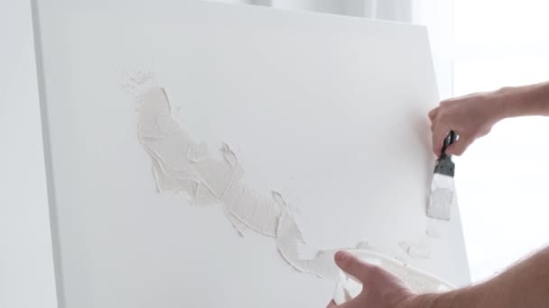 Close Artist Applies Plaster Base White Canvas Artist Works His — Stock video
