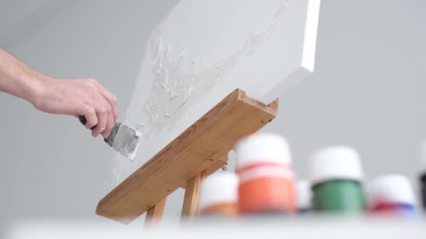 Artist Applies Plaster Base White Canvas Artist Works His Modern — Stock video