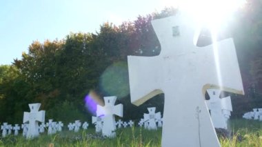 Mass burial of UPA soldiers in Lviv region. Cemetery with many white graves. 4k video