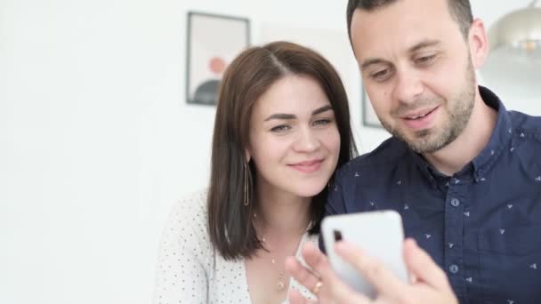 Happy Loving Husband Wife Viewing Photos Videos Phone Couple Home — Wideo stockowe