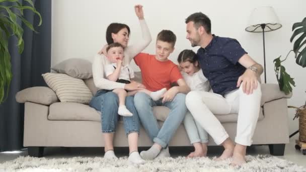 Happy Husband Wife Three Children Sitting Bright Sofa Living Room — Stok video
