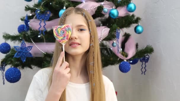 Little Girl Holding Colored Lollipop Looking Camera Candy Wooden Stick — Video