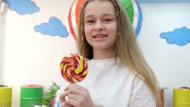 Close Portrait Beautiful Cute Baby White Shirt Holding Lollipop Looking — Stok Video