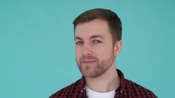 Unshaven Man Studio Turquoise Background Looks Camera Laughs Portrait Handsome — Video Stock