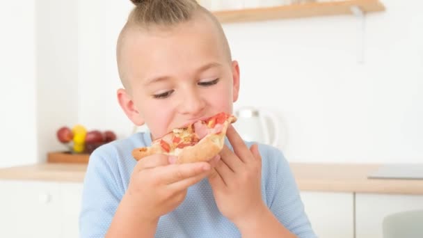 Satisfied Cute Little Boy Tied Hair Eating Slice Pizza Light — Wideo stockowe