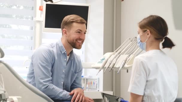 Positive Young Man Consultation Dentist Modern Dental Office Timely Dental — 图库视频影像