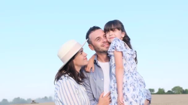 Young American Family Child Stands Field Blue Sky Hugs Happy — Stock Video
