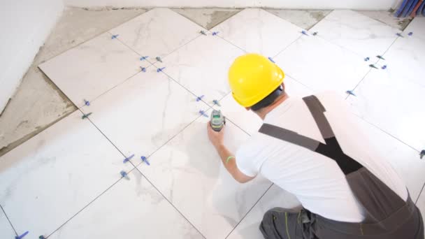 Professional Craftsman Installs Ceramic Tiles Floor Measuring Cutting Parts Construction — Stock Video