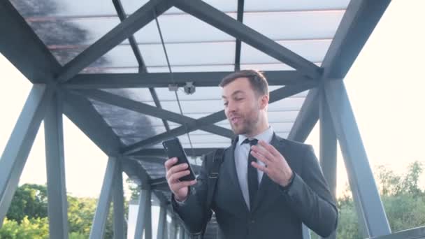 Young Successful Man Walks Airport Terminal Holds Mobile Phone His — Stock Video