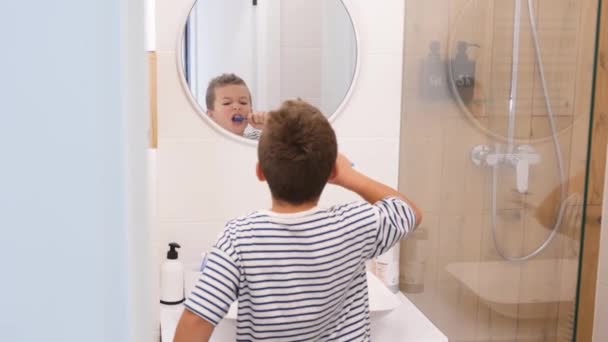 Little Cute Boy Brushes Teeth Front Mirror Bathroom Modern Interior — Stock Video