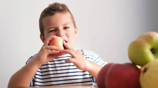 Baby Boy Bites Juicy Apple Face Child Eating Healthy Snack — Stock Photo, Image