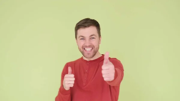 Handsome Man Beard Orange Sweater Yellow Green Background Shows Sign — Stok fotoğraf