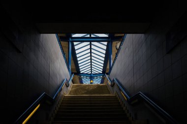 public staircase at station or mall for exit, entrance, emergency. stair inside the metro, subway with cleanly steel handrail. modern platform with granite staircase.