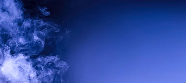 Cloud of blue smoke. Abstract smoke wallpaper background for desktop Banner design with copyspace