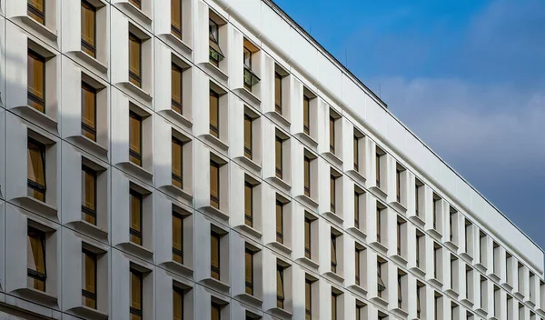 Office building windows background. Rectangular windows texture on a modern building facade.