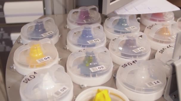 Automatic dispenser. Top view of the pigment paste containers. Open tank with yellow paint. — Stock Video