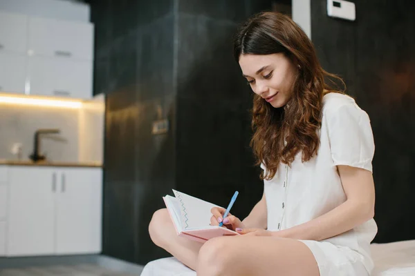 Beautiful Woman Writing Notes Bed Home Stock Phot — Stok fotoğraf