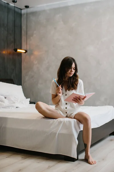 Beautiful Woman Writing Notes Bed Home Stock Photo — Stockfoto