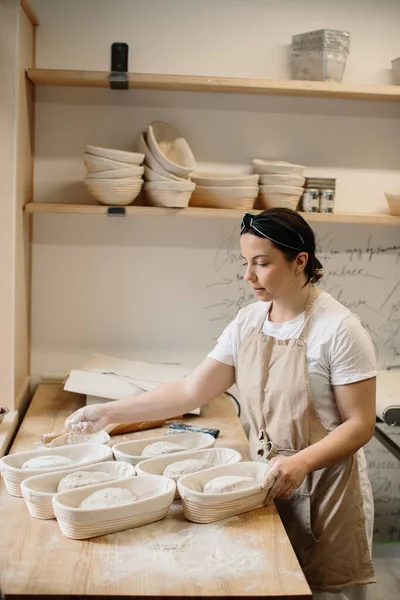 Woman Sprinkles Flour Dough Lies Forms Table Bakery — 스톡 사진