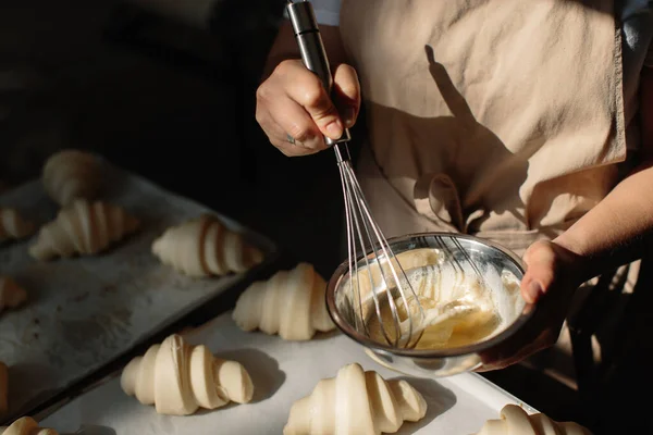 Female Baker Smears Raw Croissants Brush Yolk Cooking Process — Stok fotoğraf