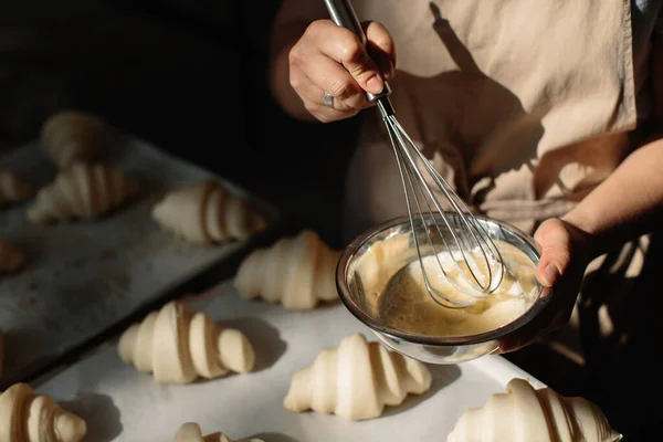 Female Baker Smears Raw Croissants Brush Yolk Cooking Process — Stock Photo, Image