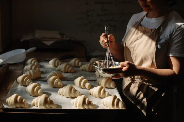 Female Baker Smears Raw Croissants Brush Yolk Cooking Process — Zdjęcie stockowe