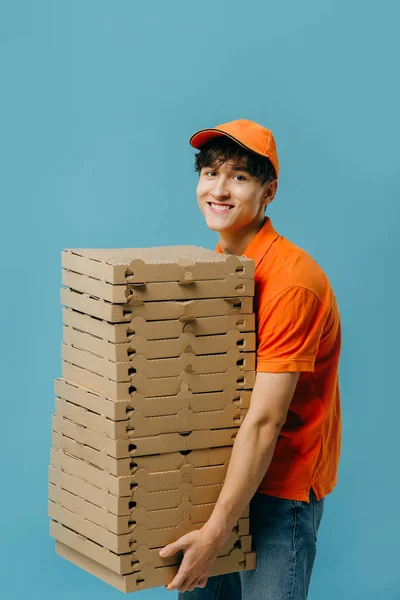 Pizza delivery concept. Pizza delivery man with lots of pizza boxes. Photo mockup.