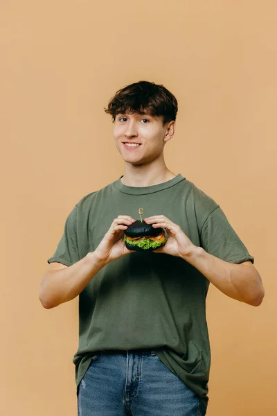 Handsome Young Man Posing Burger Colored Background — 图库照片