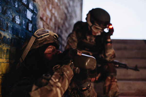 Brothers in arms resting against the background of the Ukrainian flag