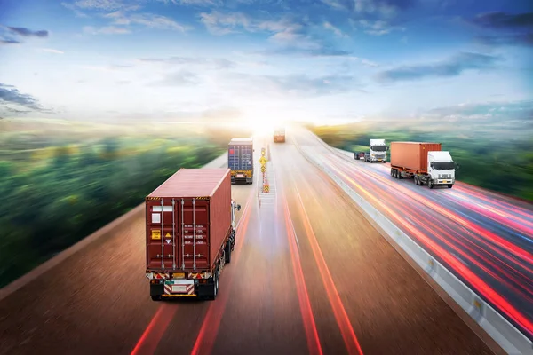 Truck Transport and Logistics Cargo Freight Import Export Concept, Truck with Red Container run on highway road at sunset sky at motion blur, Aerial view, Transportation industry background
