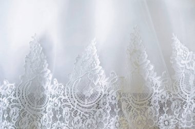 Açılış dantelli, yakın plan beyaz gelinliğin soyut arkaplanı.