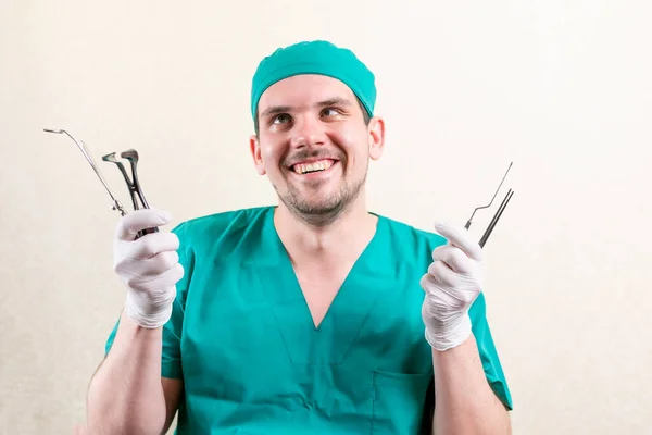 Funny doctor ENT, with instruments in his hands. — Stock Photo, Image