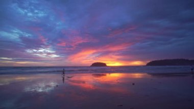 scenery sweet sky the sun down to the sea..beautiful sky at sunset in Kata beach Phuket Thailand.4k stock footage video in travel concept. sweet sky background.