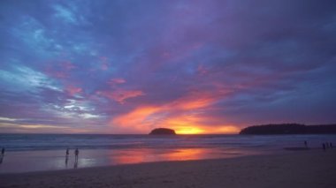 scenery sweet sky the sun down to the sea..beautiful sky at sunset in Kata beach Phuket Thailand.4k stock footage video in travel concept. sweet sky background.