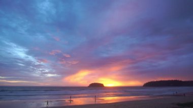scenery sweet sky the sun down to the sea..beautiful sky at sunset in Kata beach Phuket Thailand.4k stock footage video in travel concept. sweet sky background.
