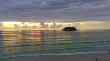 time lapse scenery sunset above the ocean clouds cover the ocean during colorful .cloud in sunset..Scene of sweet yellow light in the sky at Karon beach Phuket Thailand. .