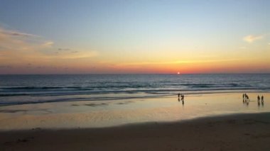 time lapse scenery sunset above the ocean clouds cover the ocean during colorful .cloud in sunset..Scene of sweet yellow light in the sky at Karon beach Phuket Thailand. .
