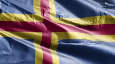 Aland tekstil bayrağı rüzgarda sallanıyor. Aland bayrağı rüzgarda sallanıyor. Kumaş dokular. Tam dolgu arkaplanı. 10 saniye döngü. 