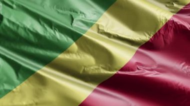 Kongo Cumhuriyeti bayrağı rüzgar döngüsünde yavaşça dalgalanıyor. Kongo Cumhuriyeti bayrağı rüzgarda sallanırken usulca sallanıyor. Tam dolgu arkaplanı. 20 saniye döngü. 