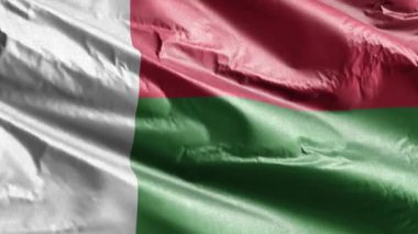 Madagaskar tekstil bayrağı rüzgar döngüsünde yavaşça dalgalanıyor. Madagaskar bayrağı rüzgarda sallanıyor. Kumaş dokular. Tam dolgu arkaplanı. 20 saniye döngü. 